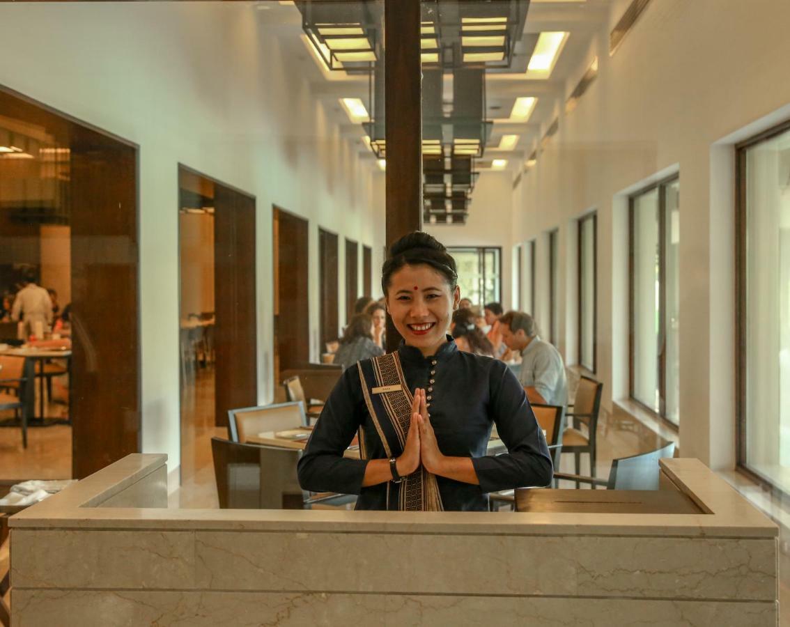 Отель Trident Agra Агра Экстерьер фото A Thai woman greeting with the wai